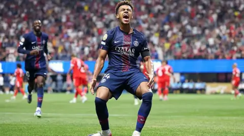 Desire Doue celebrates