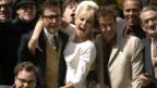 Geoffrey Rush and Charlize Theron in The Life and Death of Peter Sellers