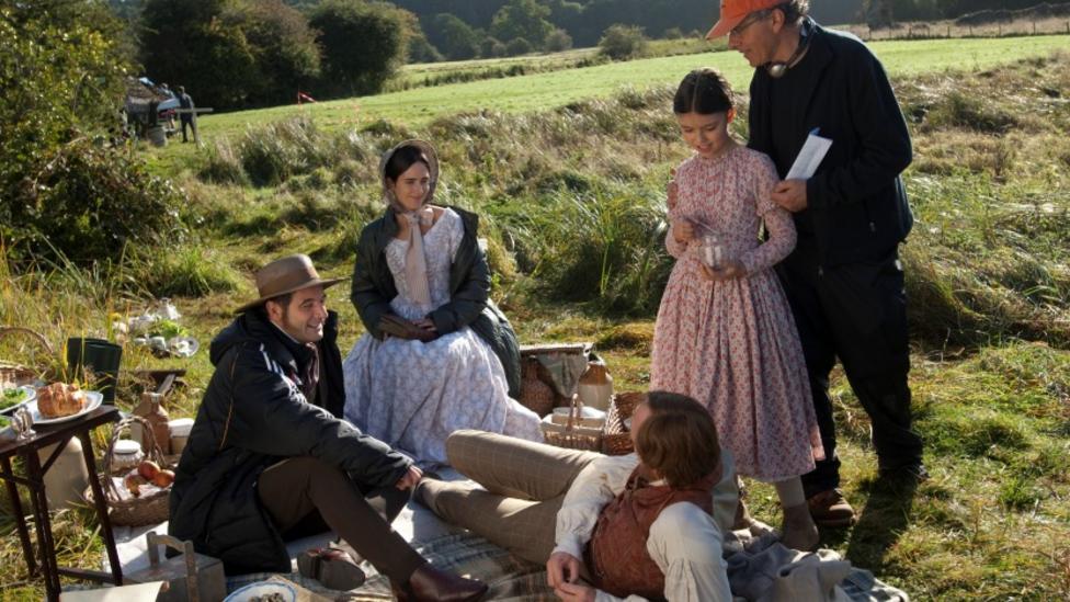 Cast and director Jon Amiel on the set of Creation