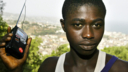 Around the world image of a boy holding a radio