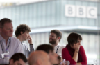 people with BBC in background