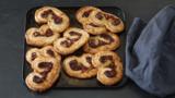 Goats' cheese, black olive and Parma ham pin-wheel palmiers