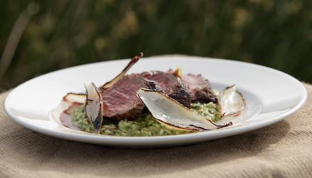 Beef with a garlic and parsley risotto and roasted shallots