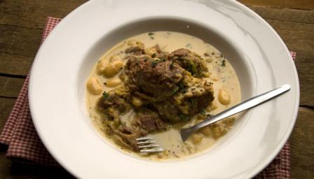 Braised pork cheeks with butter beans