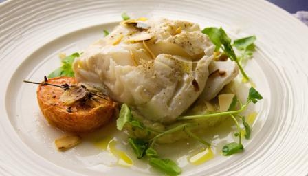 Roasted cod with skordalia sauce and garlic tomatoes