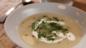 Potato soup with soured cream and chives