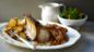 Roast pork with roast potatoes and gravy