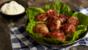 Hot chicken cakes with lettuce and mayo