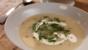 Potato soup with soured cream and chives