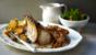 Roast pork with roast potatoes and gravy