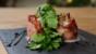 Roasted figs wrapped in Parma ham with blue cheese and rocket
