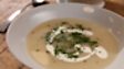 Potato soup with soured cream and chives