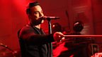Robbie Williams performing live