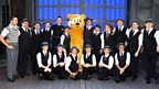 Pudsey and Geri with the cast of Singin' in the Rain