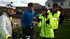 Alex Jones as Support Cyclist