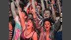 The crowd go mad for the next act...