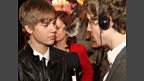 Bieber looks lovingly into the eyes of our moth.