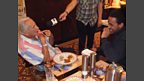 Winner samples Dev's cooking