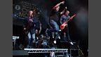 Some on-stage acrobatics from James and the band.