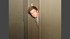 Greg hiding from his challenges in the toilets