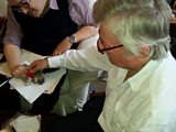 Leonard Plugge’s son Frank (right) shows his father’s medal, including his Legion d’Honneur, to presenter Dominic Sandbrook