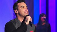 Robbie Williams performs his new single 