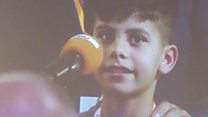 Afghan boy in tears as he thanks Merkel