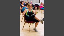 Getting down at Zumba on a chair