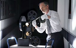 Michael Harvey with film and projector