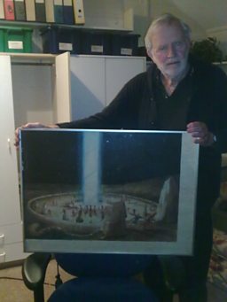 Co-creator Jeremy Burnham holds a copy of the painting ‘Quod Non Est’ 