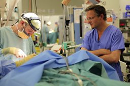 Plastic surgeon operates on a patient in Afghanistan