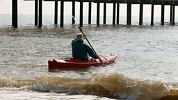 Photo: The canoe man sets off