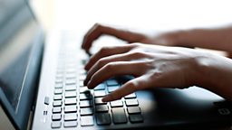 Woman typing on a laptop