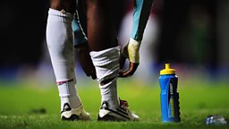 Lucozade sport on playing field