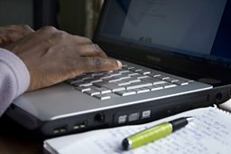 Laptop, pen and paper