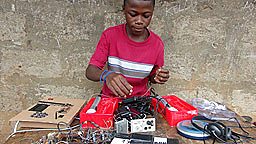 Kelvin Doe working on his FM radio transmitter
