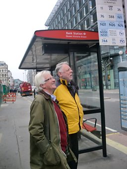 Christopher and Terry waiting for a bus to continue their journey