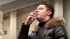 A man smoking a cigarette in Moscow