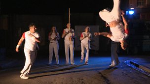 Image for Nitin Ganatra performs the capoeira section of the EastEnders Big Albert Square Dance