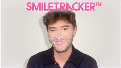 A head and shoulders picture of a person, with superimposed key points from an AI facial mapping of the person's face. The words Smile Tracker are at the top of the image.