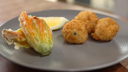Arancini with deep-fried courgette flowers