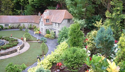 Getting the conifers just so...at Babbacombe Model Village, Torquay