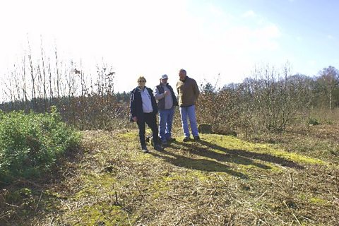 Richard stands on top of Thynghowe with Lynda Mallett and Stuart Reddish
