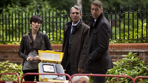 Kate, Nigel & 'Dot' look on as AC-12 look for the glass from Jackie's house