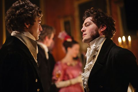Pip (Douglas Booth) and Bentley Drummle (Tom Burke) at the ball