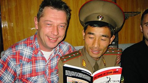 Andy with a border guard on board a train heading for Pyongyang