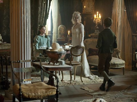 Miss Havisham (Gillian Anderson) invites Pip (Oscar Kennedy) to meet Estella (Izzy Meikle-Small)