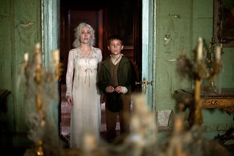 Young Pip (Oscar Kennedy) and Miss Havisham (Gillian Anderson)