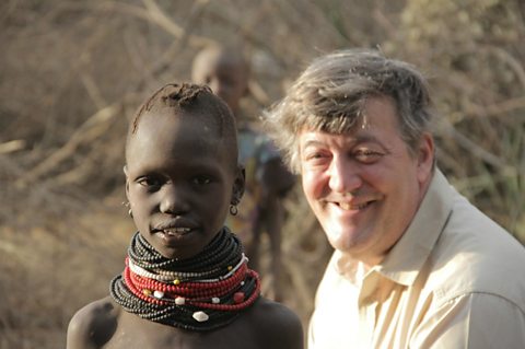 Stephen Fry with a Turkana child