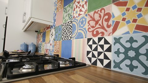 AFTER: THE TILES ADD A SPLASH OF COLOUR IN THE KITCHEN
